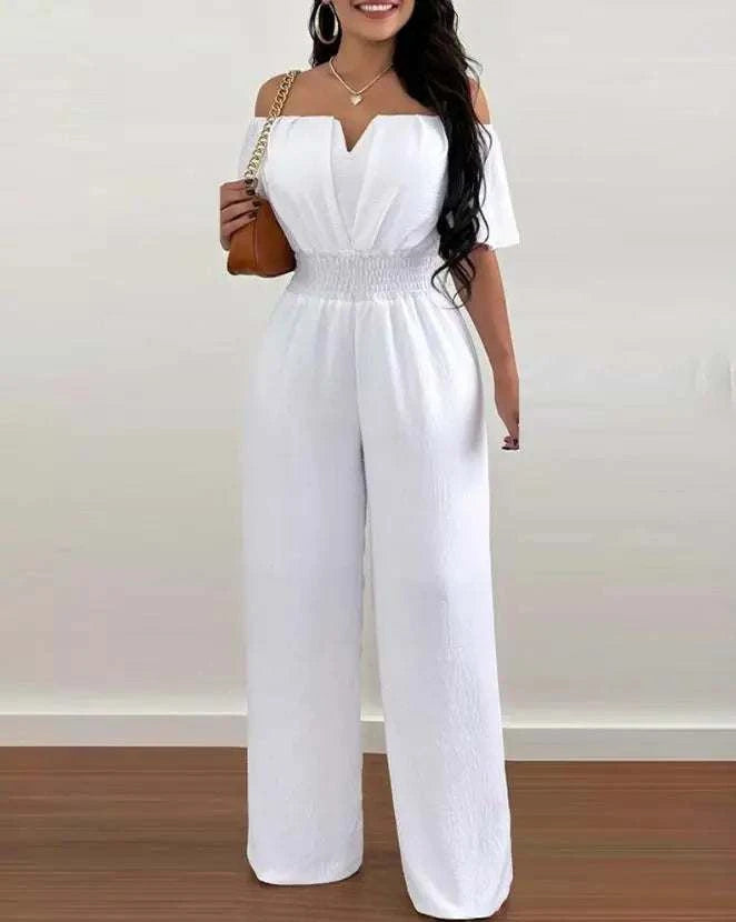 Woman wearing off-shoulder casual plain short sleeve wide leg jumpsuit for spring 2025