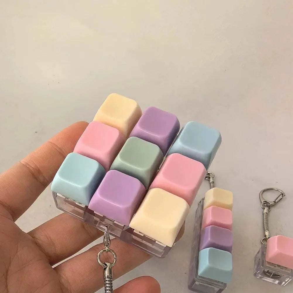 Colorful plastic fidget decompression keyboard key toy with keychain for stress relief and portability