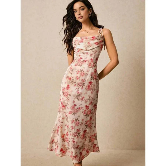 Middle-aged woman wearing a knee-length women's floral print dress with twist front and bow neckline